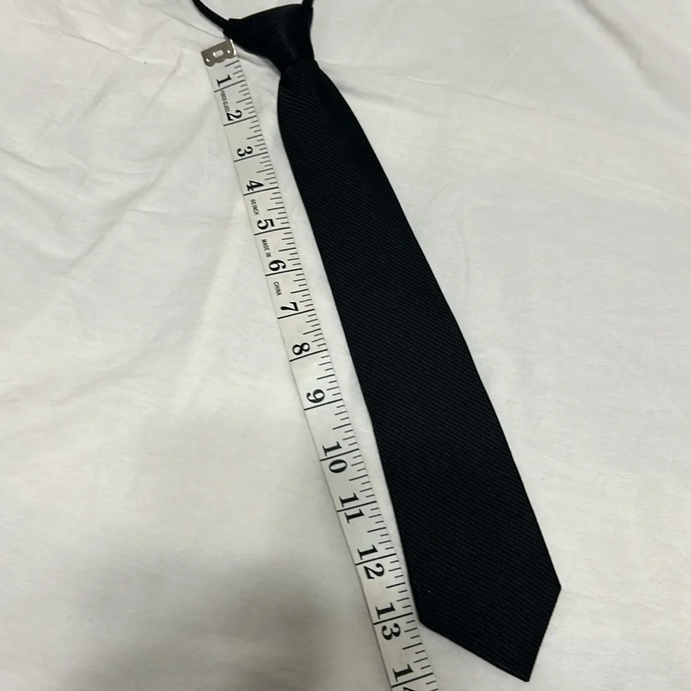 Neck Tie in black, zipper adjustable. Formal wear Preowned great condition.